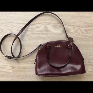 Coach cross body patent dark magenta.